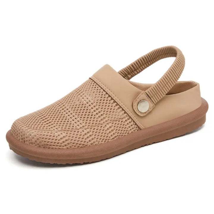 Beige breathable mesh slip-on mules for women, featuring a backless design, elasticated heel strap, and a comfortable flat rubber sole.