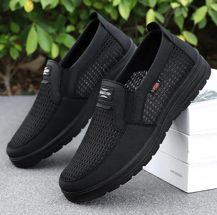 Three-quarter view of black breathable mesh men&
