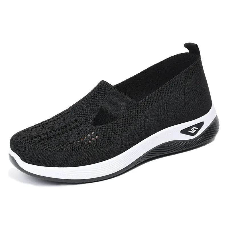 Faelan women's black breathable knit mesh slip-on loafers with a geometric pattern and white EVA sole, shown from a three-quarter angle.