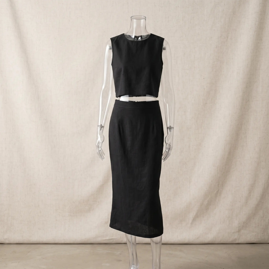 Sleeveless black linen-blend crop top and midi skirt set, presented on a mannequin with a rounded neckline and subtle shoulder padding.