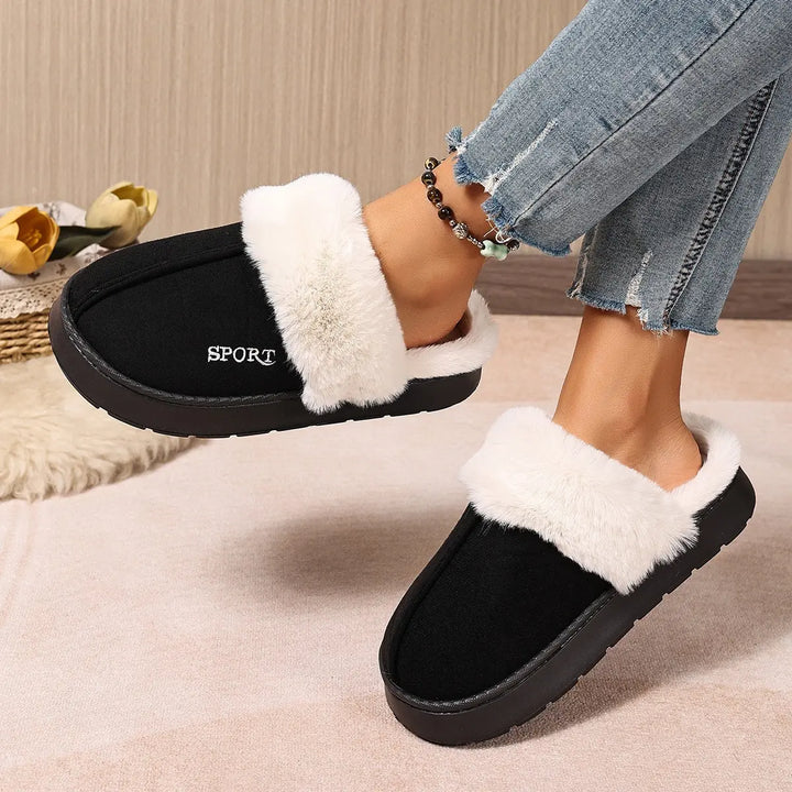 Black plush mule slippers with white faux fur trim and embroidered &