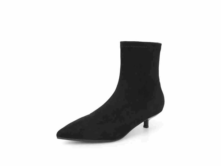 Chic black stiletto ankle boots with a pointed toe, stretch sock-like shaft, and a slender kitten heel, presented from a three-quarter view on a white background.