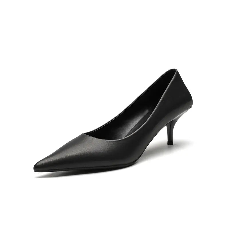A black high-gloss faux leather stiletto heel shown from the side, featuring a sharply pointed toe and a slender heel.