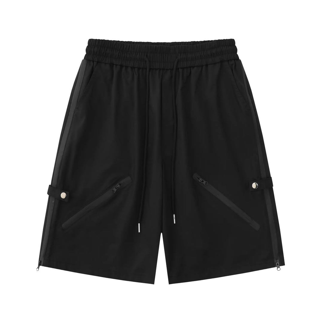 Matte black relaxed-fit technical shorts with diagonal zip pockets and rear snap button details. Features an elasticated waistband and clean hem.