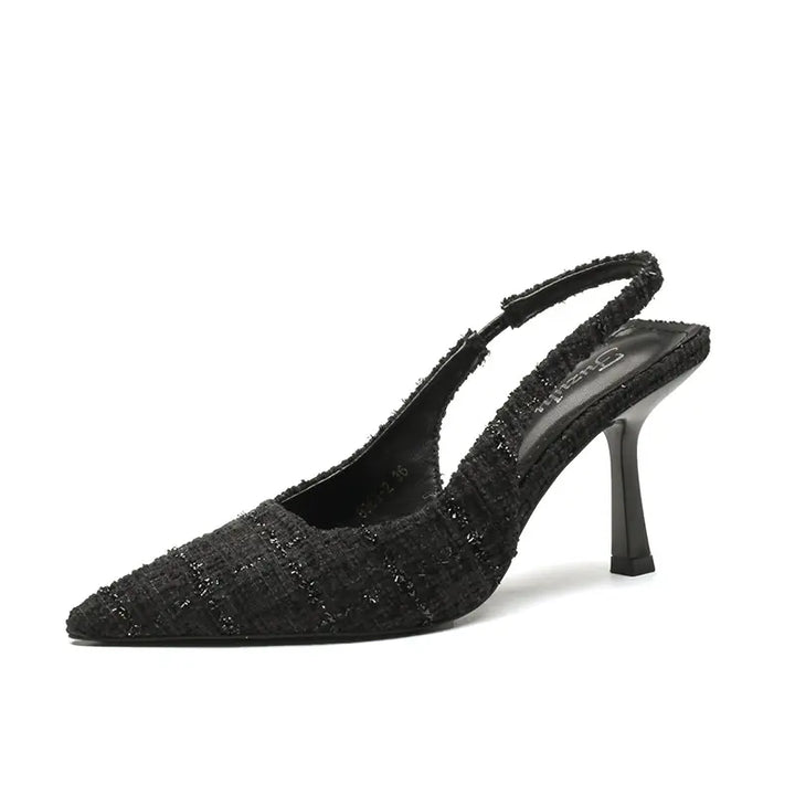 Chic Qalani black tweed-like pointed toe slingback heels with a stiletto heel and adjustable buckle strap.