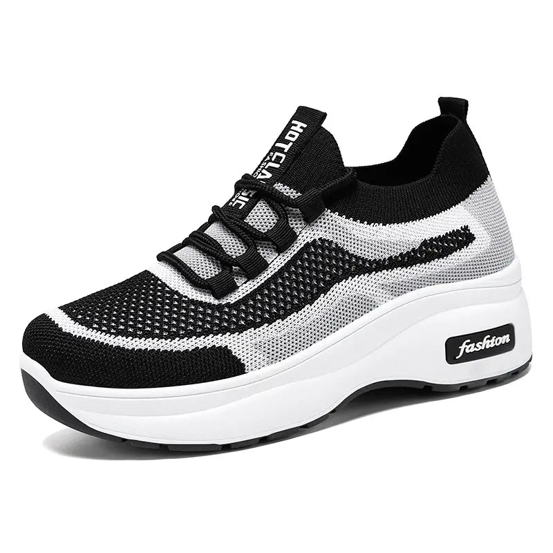 Chunky platform trainers in black and white knit with a striped pattern, featuring a white midsole with subtle &