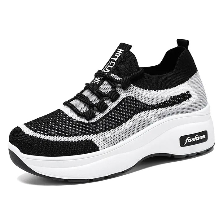 Chunky platform trainers in black and white knit with a striped pattern, featuring a white midsole with subtle &
