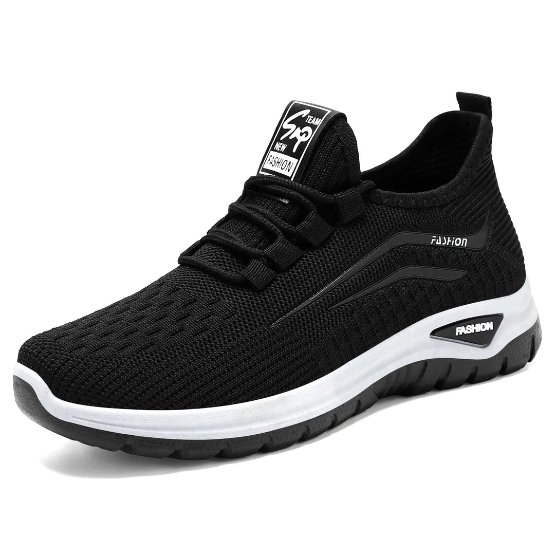 A black Zentiva breathable knit trainer shown in a three-quarter view on a clean white studio background, featuring integrated lacing and a subtle &