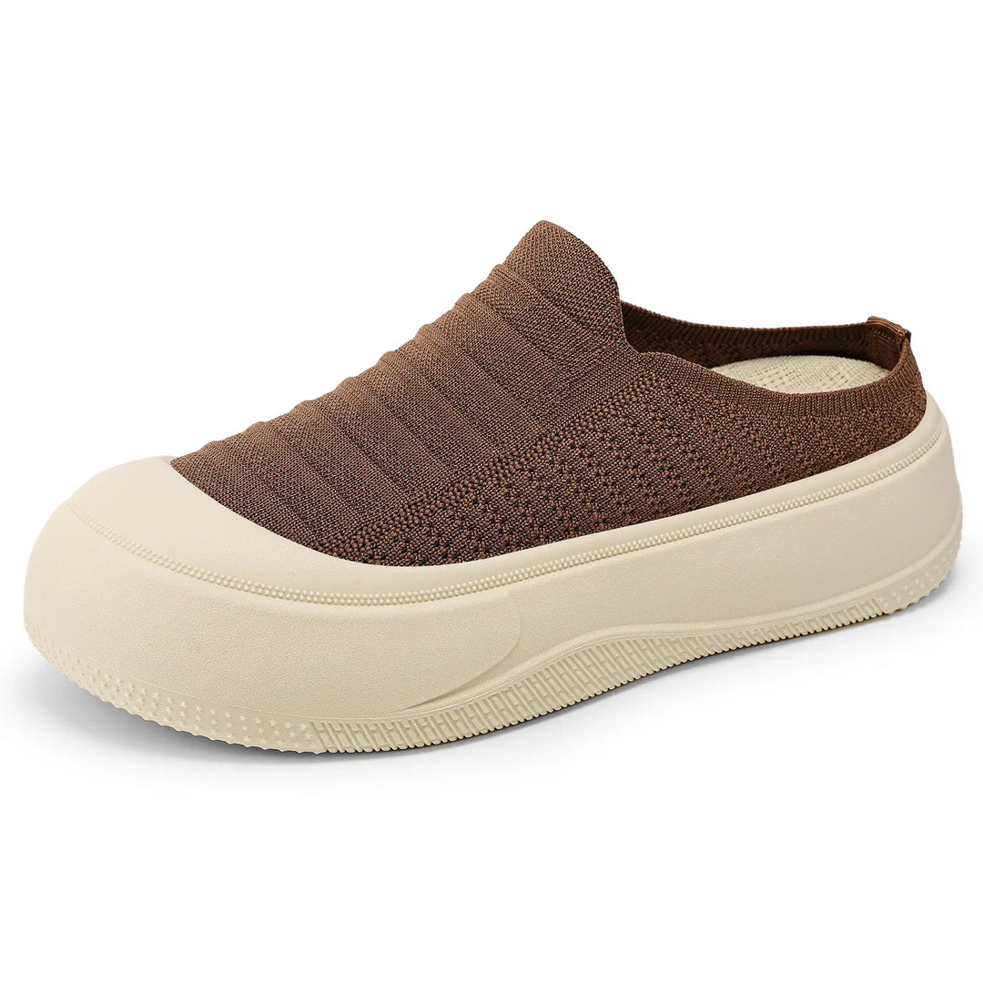 Brown knitted slip-on mules with a round closed toe and a thick, contrasting cream-colored chunky platform sole.