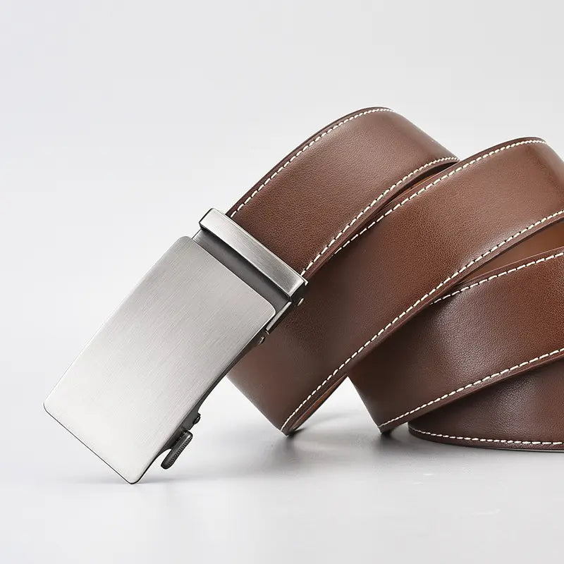 Brown genuine leather automatic belt with white contrast stitching and a brushed silver buckle, coiled presentation on a clean white background.