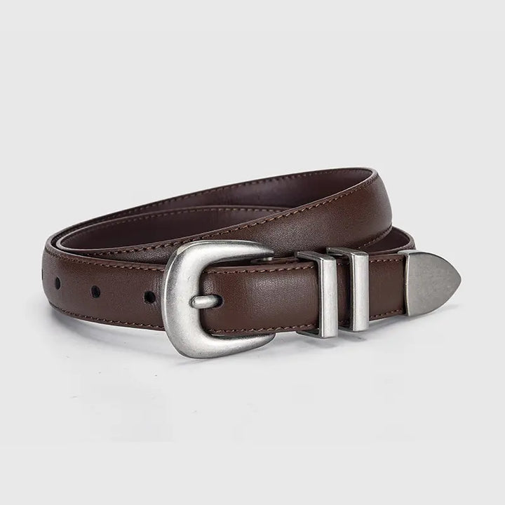 Brown genuine top-layer cowhide leather belt with an antiqued silver Western-style buckle and dual slot keeper, shown at a three-quarter angle.