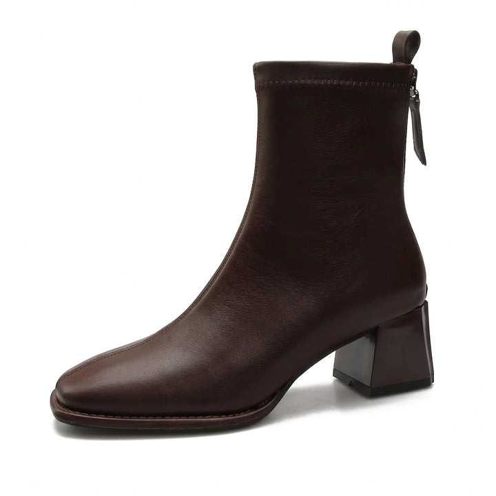 Brown faux leather ankle boots with a chic square toe, comfortable block heel, and rear zipper closure, featuring a fleece-lined interior for warmth.