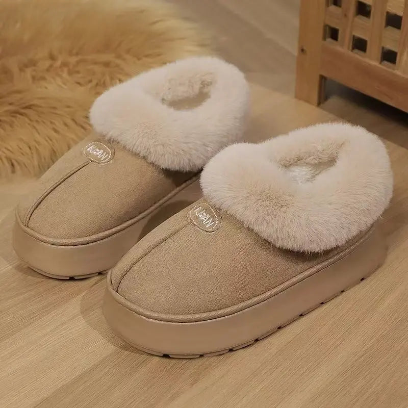 Camel suede-like mule slippers featuring a plush faux fur trim around the opening and a thick, durable EVA platform sole. The design includes a subtle embroidered &