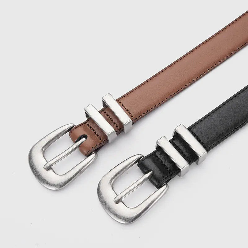 Drejka classic black and brown leather belts shown with antiqued silver-tone Western buckles and dual slot keepers.