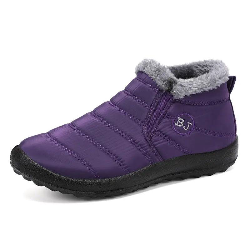 Faelan unisex waterproof ankle boots in deep purple quilted nylon with plush grey faux fur lining and elasticated side panels, featuring a subtle embroidered BJ logo.