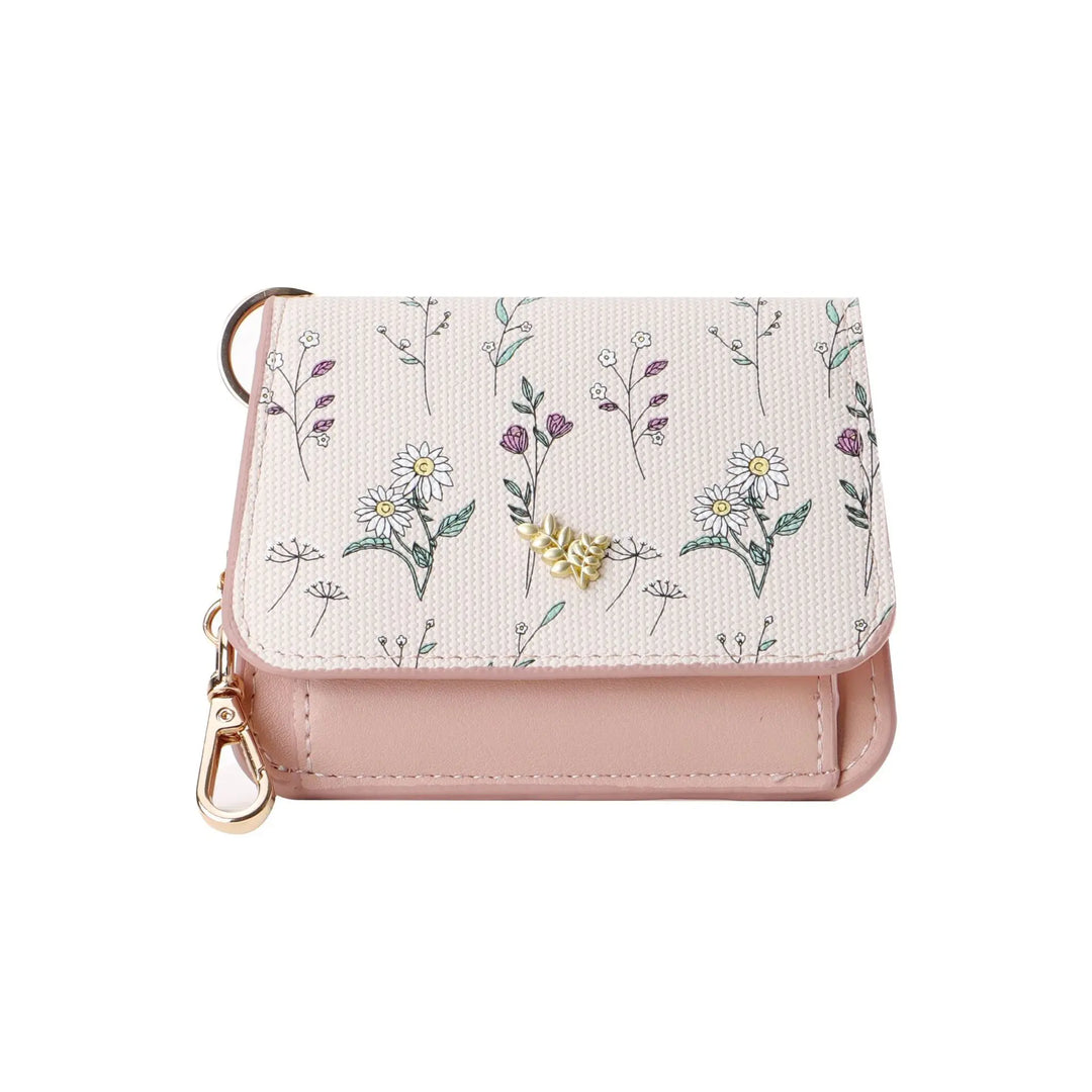 Compact tri-fold wallet featuring a delicate floral print on textured fabric and smooth pastel PU leather, with gold-tone hardware, snap closure, and integrated keychain.
