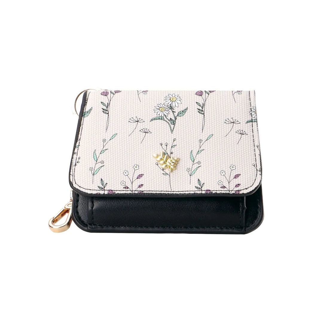 Compact tri-fold floral print PU leather wallet with gold hardware and integrated keychain, presented in a front view on a white background.