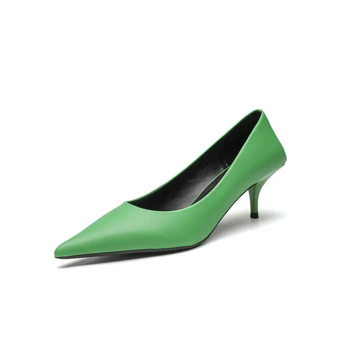 Vivid green high-gloss faux leather stiletto heel with a sharp pointed toe, low-cut vamp, and a slender sculpted stiletto heel.