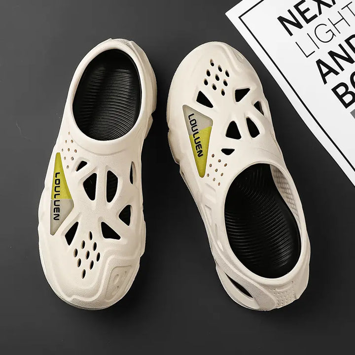 Cream beige Kaelen EVA clogs summer sandals for men, featuring a slip-on mule style with a thick sculpted sole, geometric cut-outs, and contrasting orange interior lining.