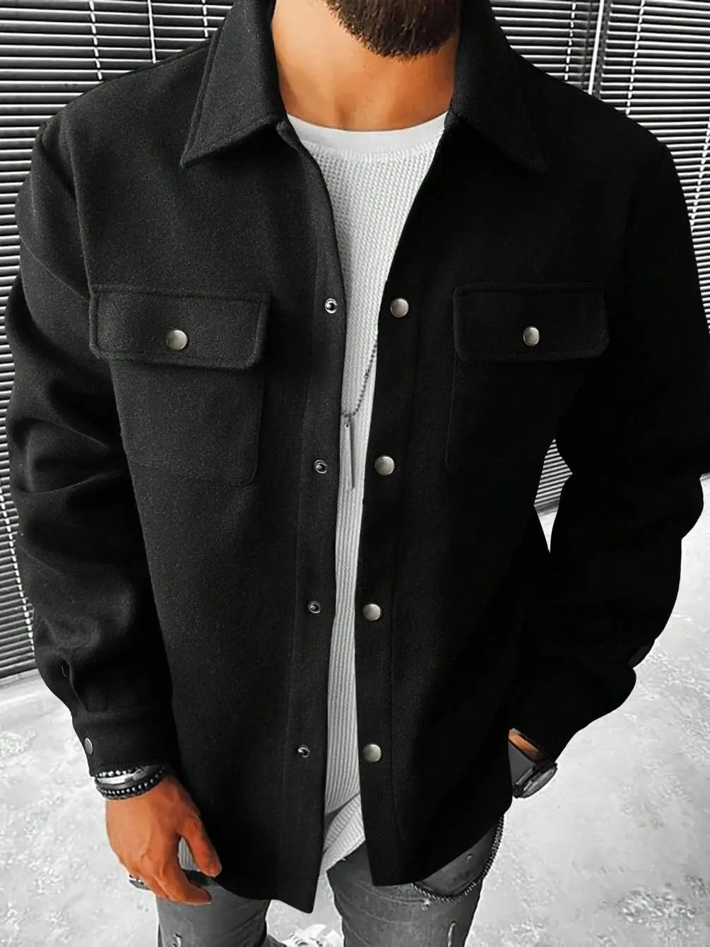 A man wearing a black Kaelen brushed polyester shacket with a spread collar and dual chest pockets, styled casually over a white t-shirt.