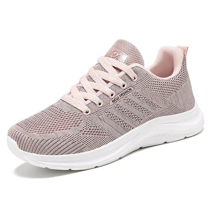 Pink Kaelen breathable mesh running trainers for women, showcasing a lightweight, modern design with a cushioned sole for exceptional everyday comfort and agile movement.