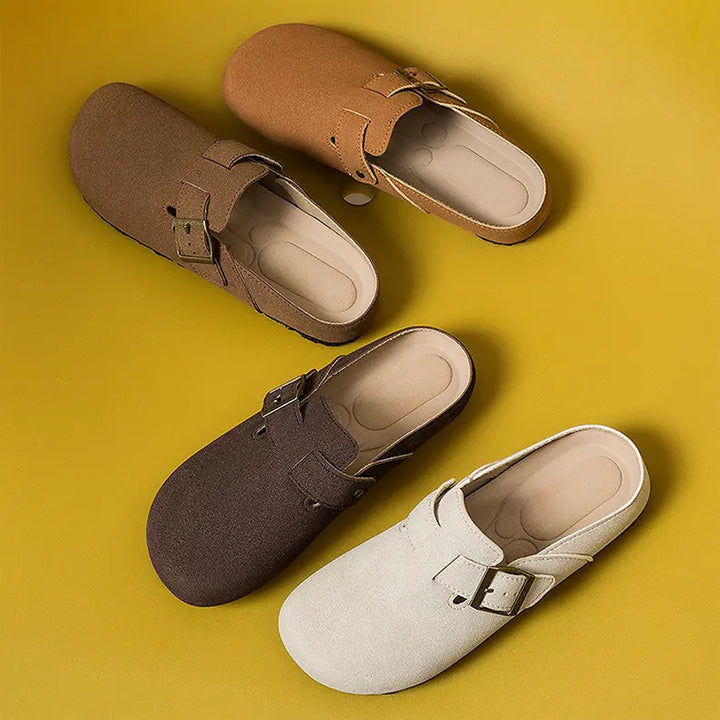 Studio shot of Kaelen retro buckle mules in taupe, brown, and sand suede-effect finish, showcasing the adjustable buckle detail and round toe design.