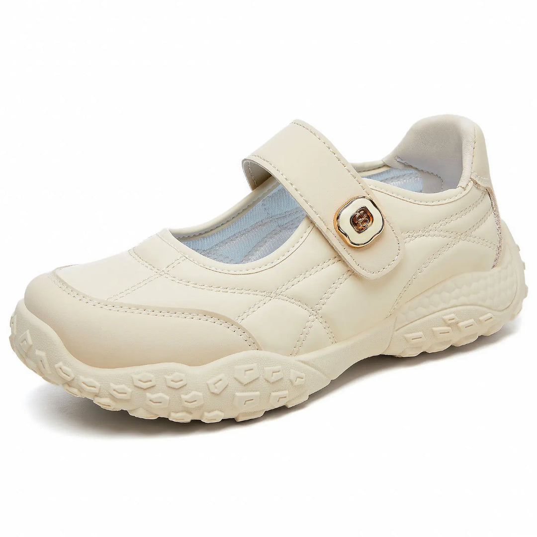 Kaelis cream white quilted Mary Jane flats with an adjustable hook-and-loop strap and a decorative gold buckle, featuring a chunky rubber sole.