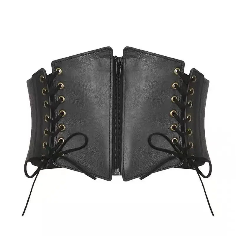 Matte black faux leather corset belt with antique brass grommets and lace-up sides, featuring a central zipper closure.