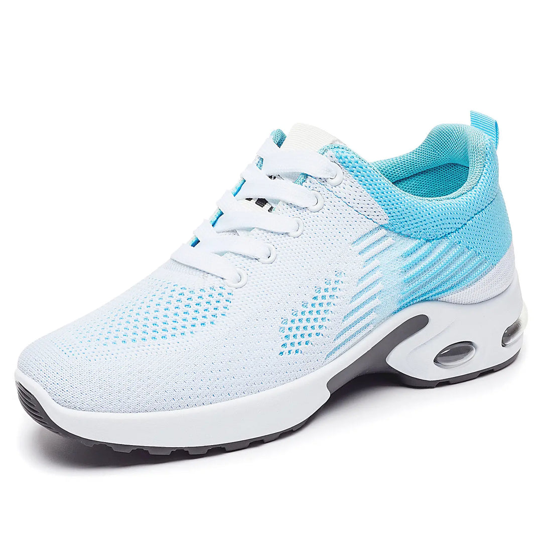 White and light blue breathable knit trainers with abstract stripe pattern, shown in a front view with a visible air cushion sole.