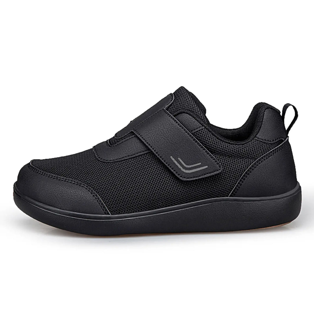 Kaelo black breathable mesh walking shoes with adjustable hook-and-loop strap and black EVA sole, shown from the side on a white background.