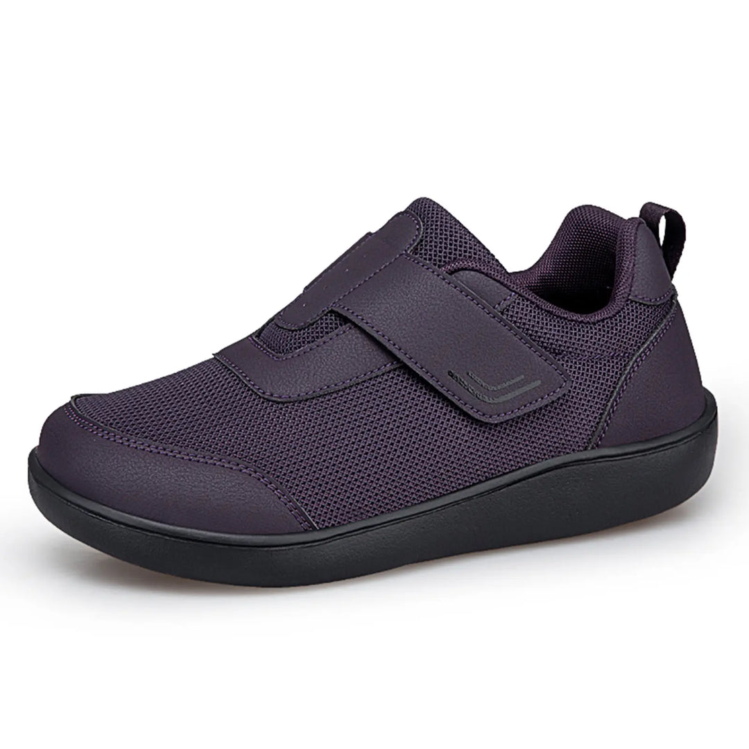 Kaelo breathable mesh walking shoe in purple and black, shown from a side profile with a hook-and-loop strap closure.
