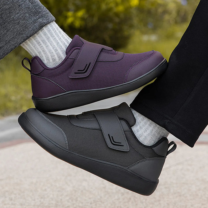 Kaelo breathable mesh walking shoes in purple and black, shown worn by models with dual hook-and-loop straps in an outdoor setting.