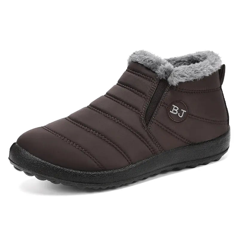 Brown quilted winter boots with plush grey faux fur lining and elastic side gussets, presented in a three-quarter front view on a white background.