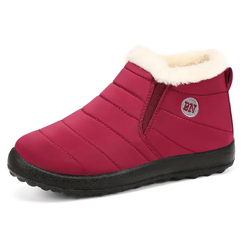 Kaelum unisex ankle winter boots in deep red, featuring a quilted water-resistant upper, plush grey faux fur lining, and a durable slip-on design with elasticated side panels.