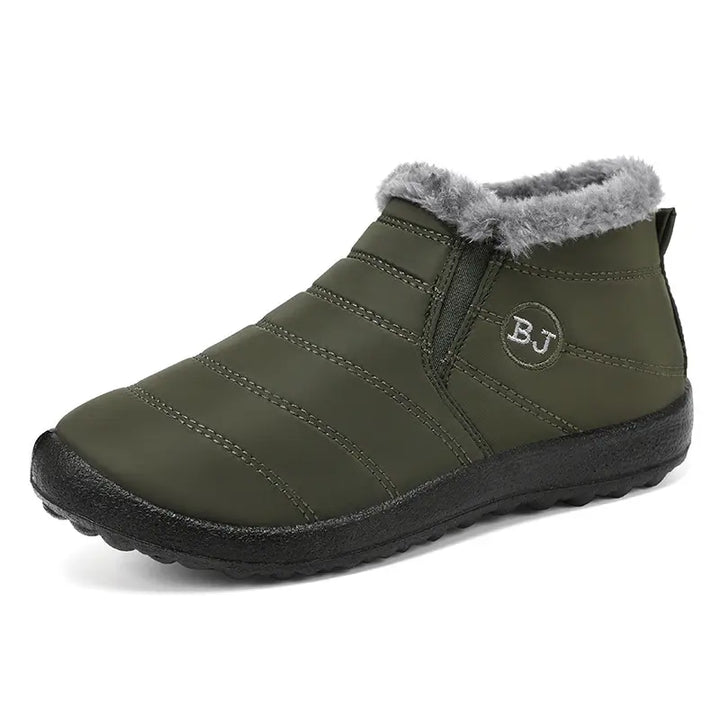 Kaelum unisex quilted green winter ankle boots with faux fur lining and a slip-on design, shown from a three-quarter front view.
