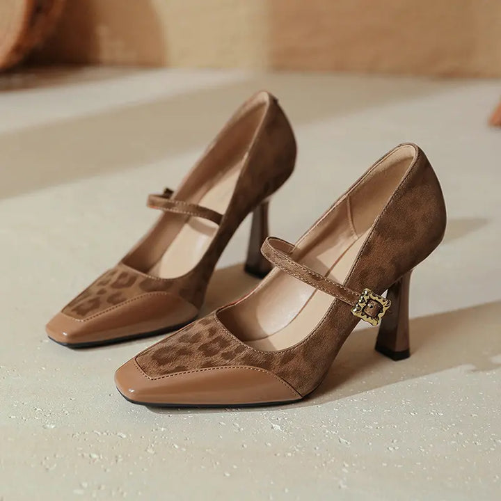 Kaelum patent leather and leopard print suede Mary Jane heels with a square toe and gold buckle strap, shown from the side profile.