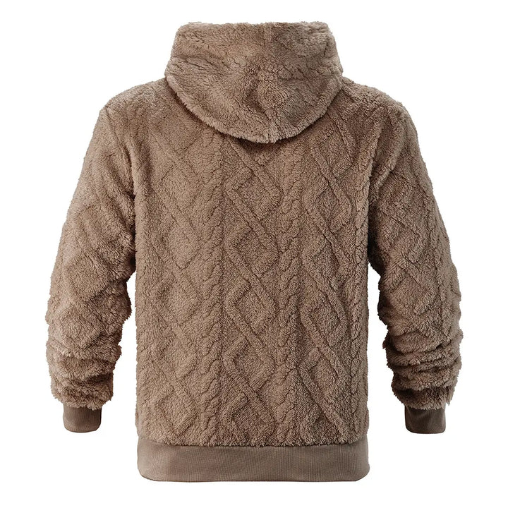 Back view of a Kaelum textured fleece hoodie in warm ivory, showcasing its unique chevron pattern and relaxed silhouette with ribbed cuffs and hem.