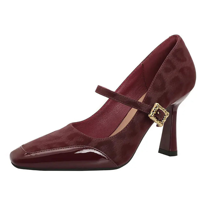 Kaelum wine red patent leather Mary Jane heels featuring a square toe, leopard print suede panels, and a decorative gold-tone buckle strap.