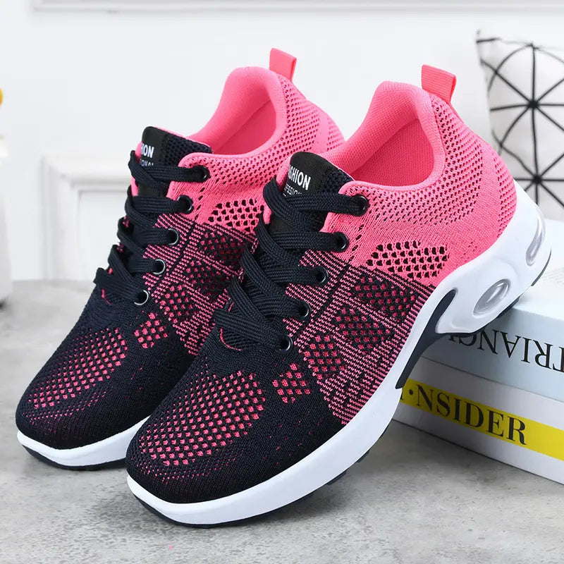 Women's Kevran purple and black knit mesh sneakers with a vibrant pink lining, shown in a three-quarter front view with laces and a cushioned sole.