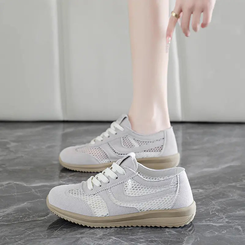 Light grey Khyzra breathable mesh trainers shown on a model&