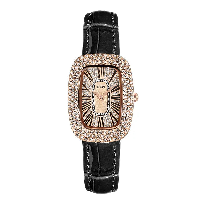 Kryllon oval rose gold watch with a crystal-embellished bezel, champagne sunburst dial featuring Roman numerals, and a black alligator-embossed leather strap.