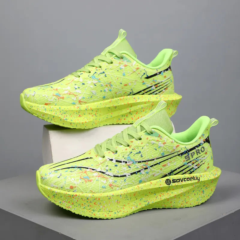 Dynamic lime green running shoes with vibrant multi-color paint splash pattern and sculpted speckled midsole, shown from a three-quarter angle.