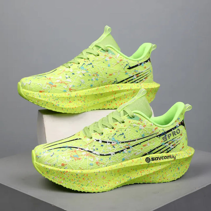 Dynamic lime green running shoes with vibrant multi-color paint splash pattern and sculpted speckled midsole, shown from a three-quarter angle.