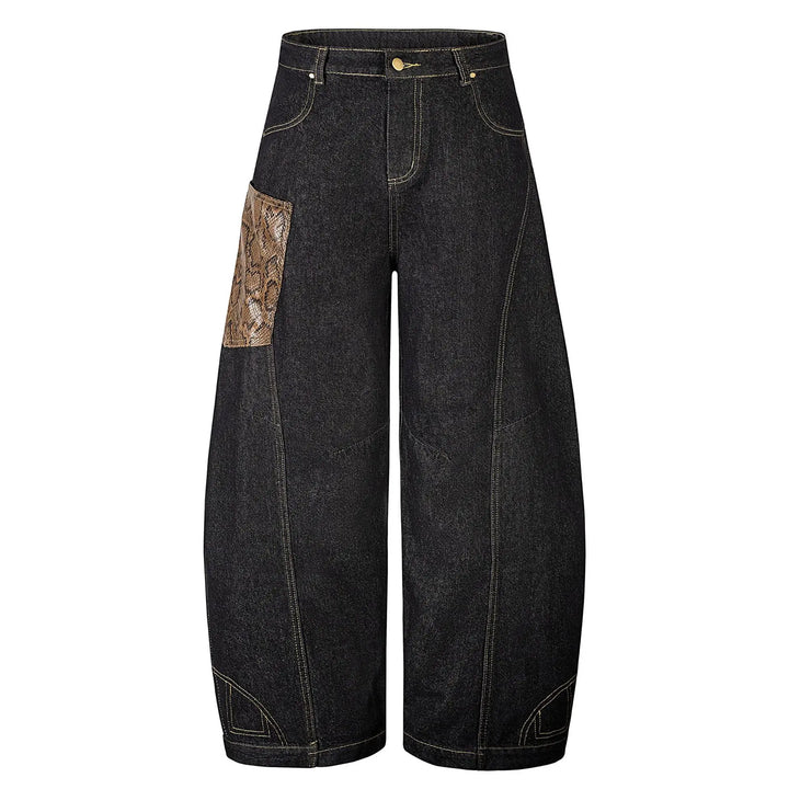 Front view of Kylath wide leg jeans in dark wash denim, featuring a distinctive snake print panel on the thigh and a floor-length silhouette.