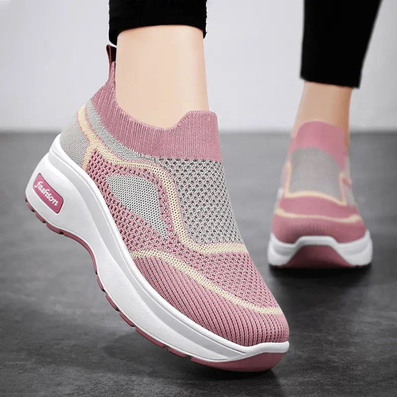 LyraFit breathable knit slip-on sneakers in vibrant pink with grey and cream accents, featuring a thick white platform sole with a 'Fashion' logo detail.