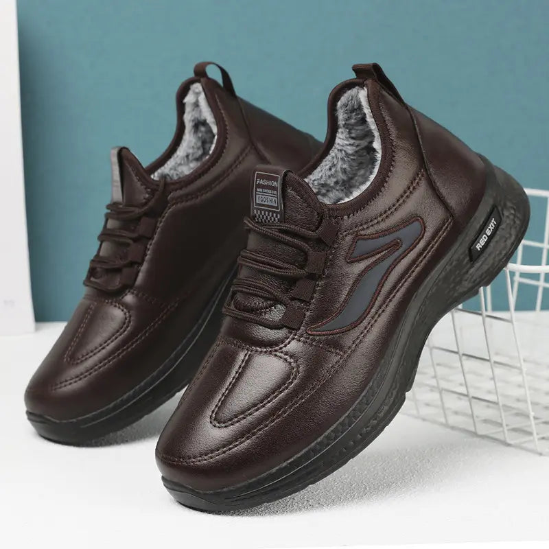 Espresso brown men's faux leather ankle boots with plush grey lining, featuring a matte black polyurethane sole and subtle side panel accent. Side view showing lace-up closure and round toe.