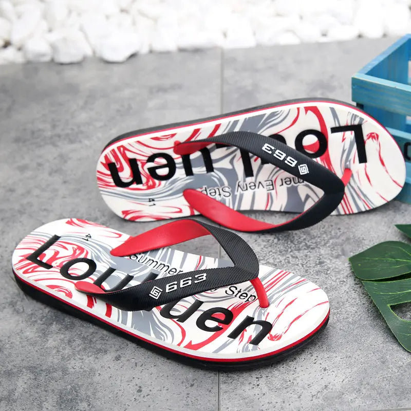 Men's black and red graphic print flip-flops with a white and grey swirling pattern on the footbed, displaying 'LOUMEN' text. Features matte black PVC straps with red lining and a non-slip tread sole.