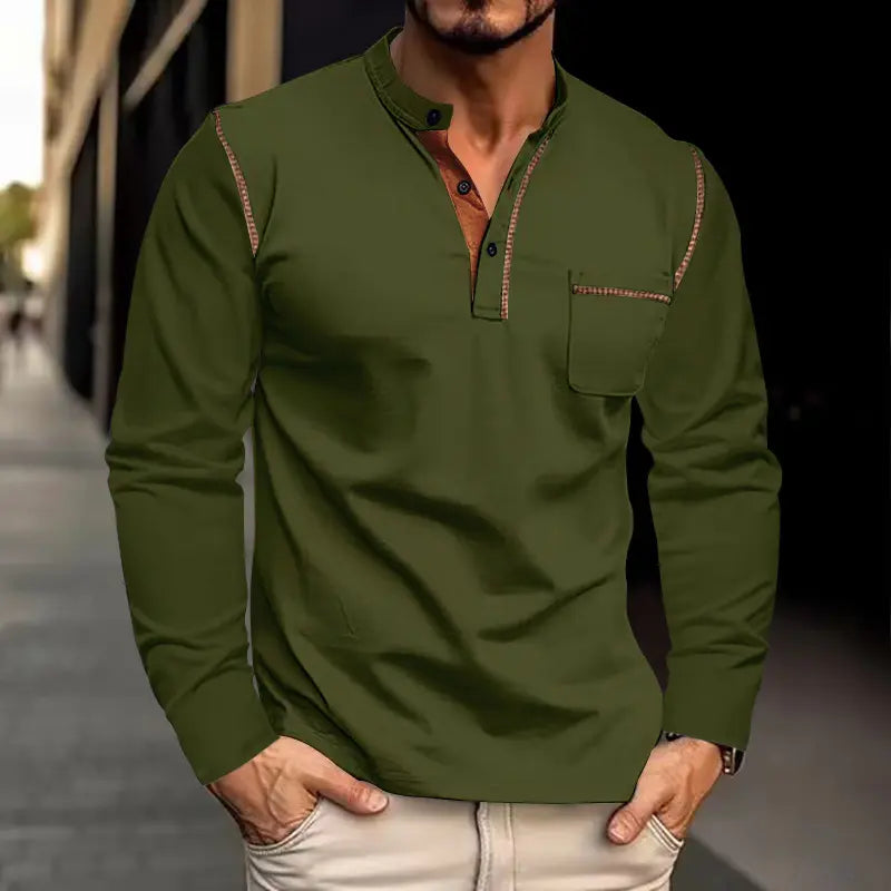 Men's Zylos long-sleeve casual shirt in olive green, featuring a mandarin collar with contrasting tan placket and brown piping details, worn by a model in an urban outdoor setting.