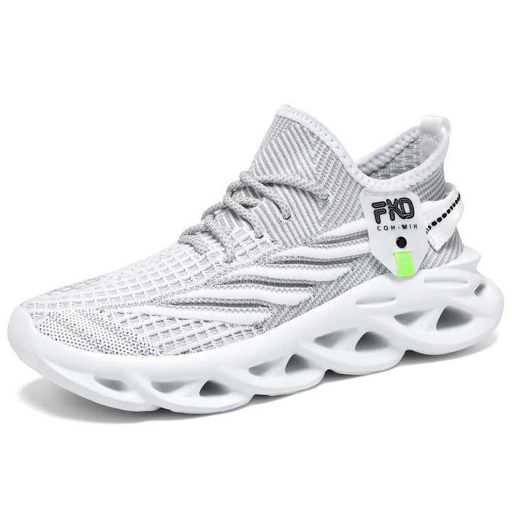 Mikari modern casual trainers featuring a breathable beige and grey engineered knit upper with a sculpted light tan sole and a bright lime green accent tag.
