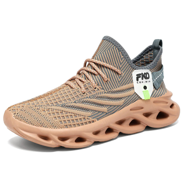 Mikari high-top breathable knit sneakers in warm beige and grey, featuring a sculpted light tan sole, lace-up closure, and a small lime green tag detail. Presented from a three-quarter view on a white background.